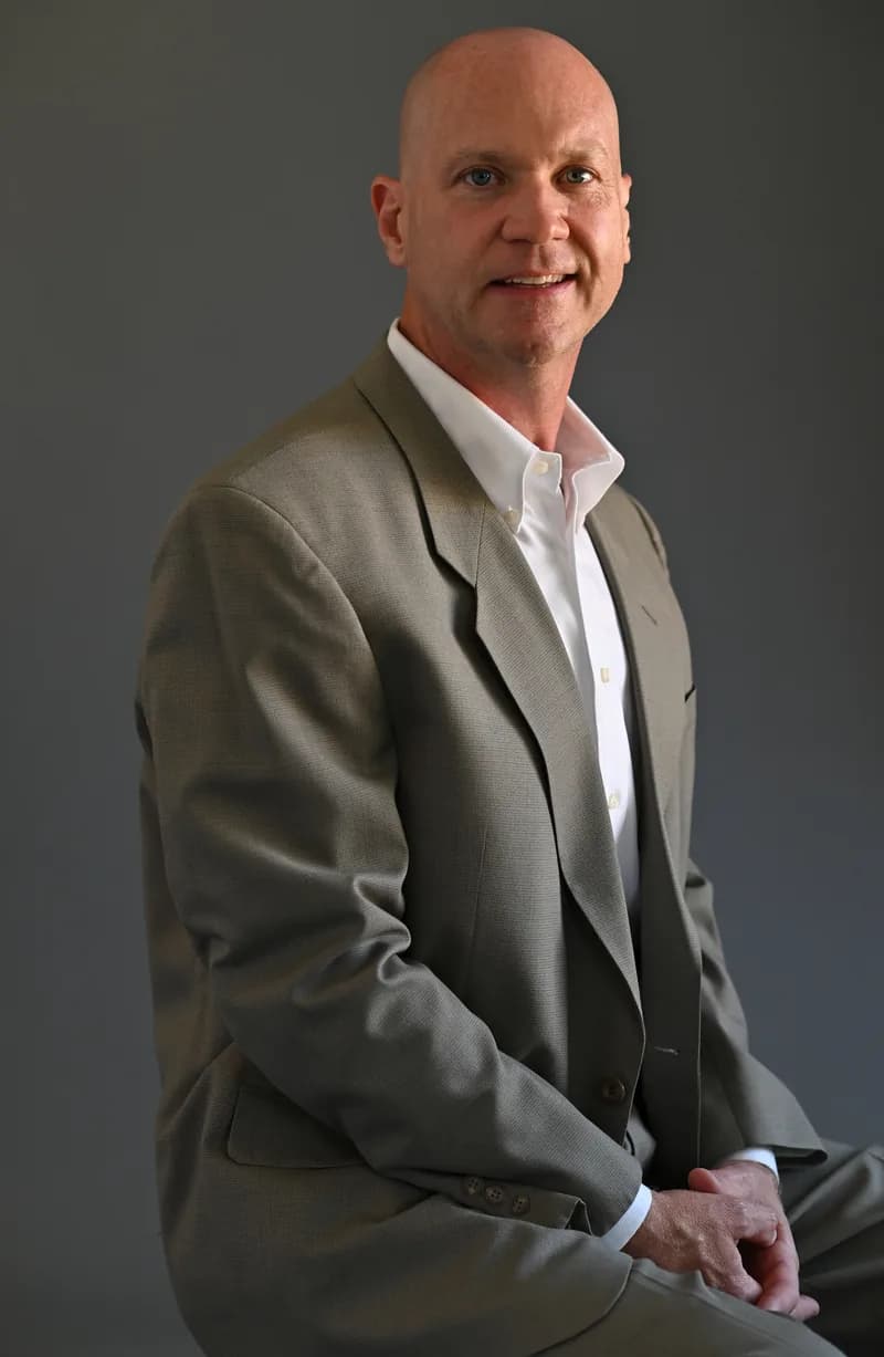 Jody McNamer, real estate broker, in a navy suit